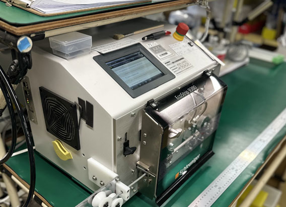 Wire cutting and stripping machine